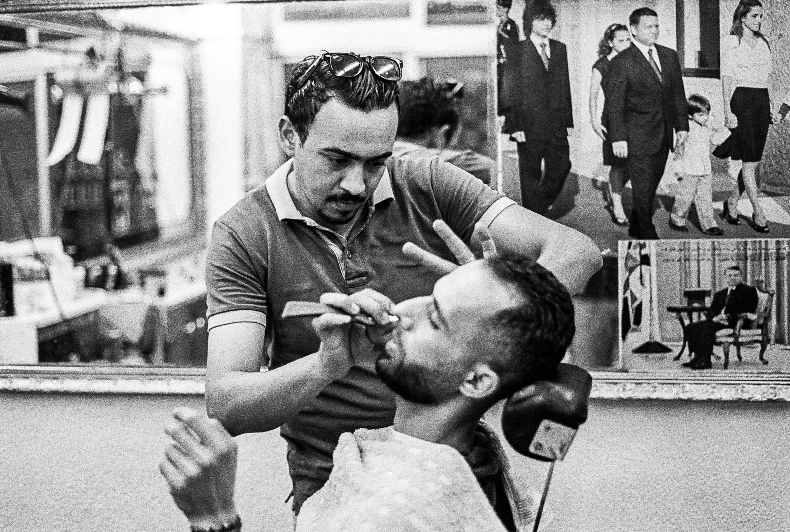 Barber with pictures of king Abdullah II, Amman, Jordan (2017)